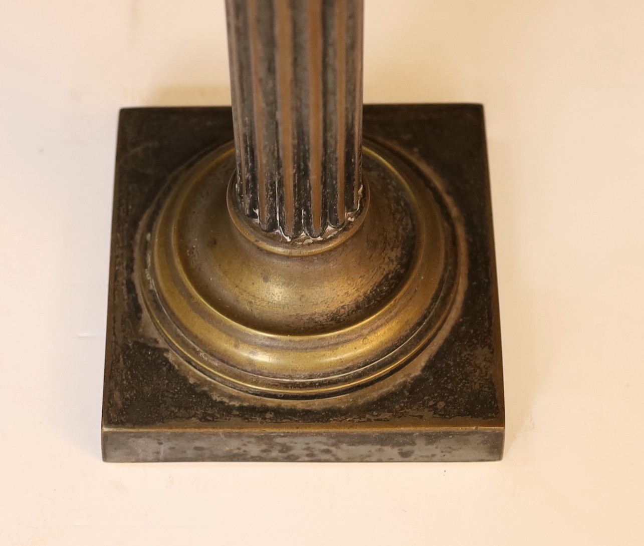 An Edwardian brass column oil lamp with cut glass reservoir, ANCS mechanism and etched shade, height overall 70cm